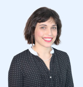 Ali Lipman wearing a black blouse with small white polka dots and white collar.