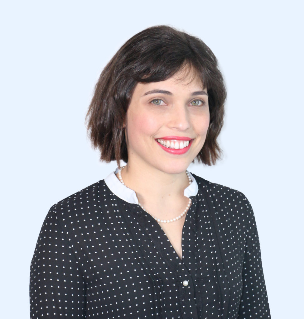 Ali Lipman wearing a black blouse with small white polka dots and white collar.