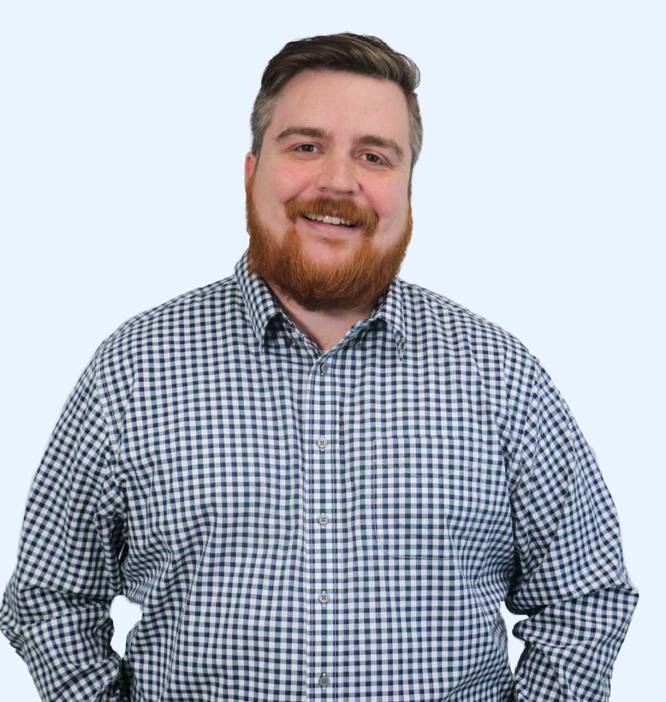 Brian Anderson wearing a patterned white and black button-up shirt.